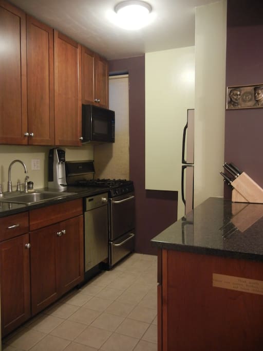 Kitchen newly renovated with stainless steel appliances, and granite countertops