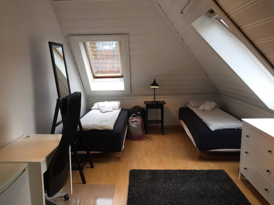 Your room with two single bed configuration.