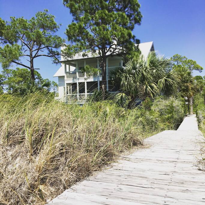View of home from the beach with private boardwalk