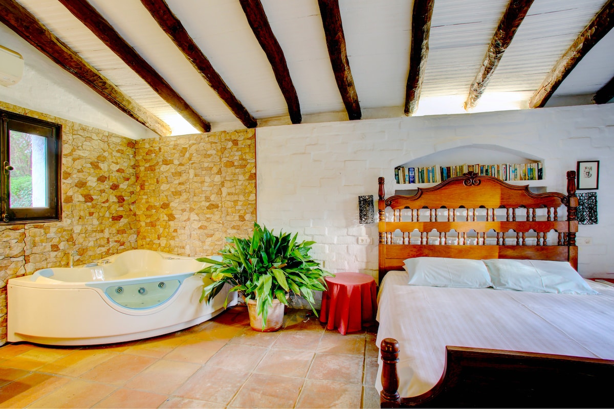 Small cottage bedroom and jacuzzi