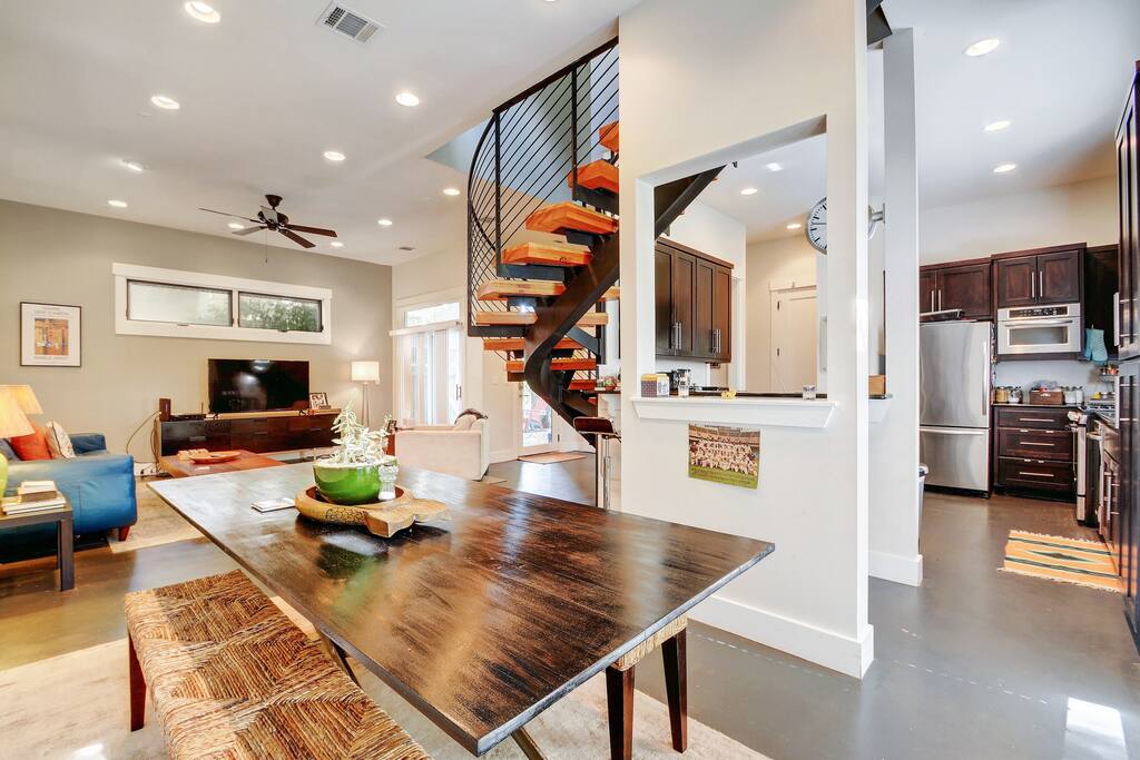 Sit down to a feast for 8, right next to the kitchen, where 4 more can sit at the breakfast bar.