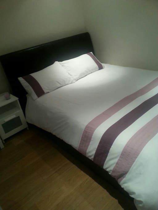 Large comfortable king size bed with additional lift storage.