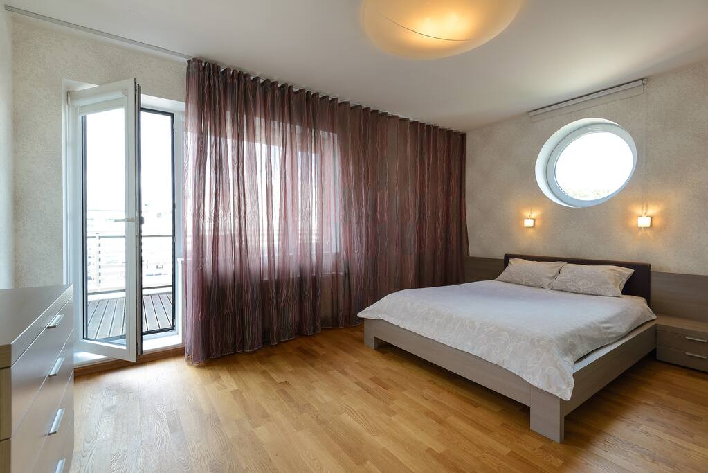 Master bedroom with a terrace