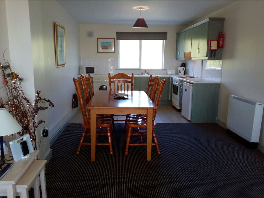 Well equipped kitchen and dining area.