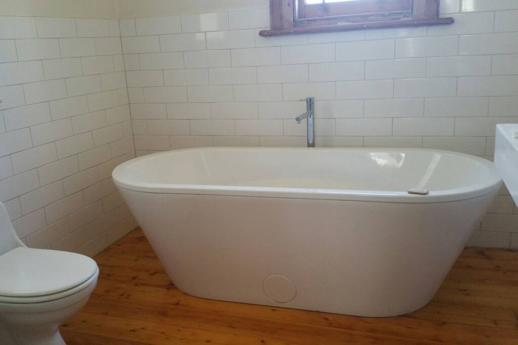 The bathroom has beautiful European fittings