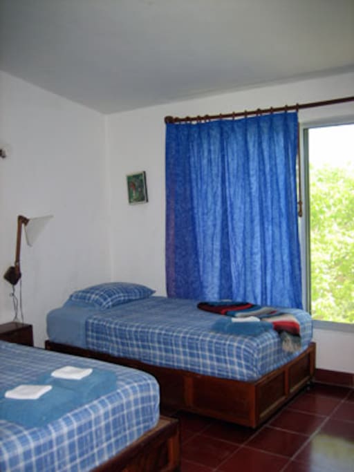 Bedroom with a double and a single bed