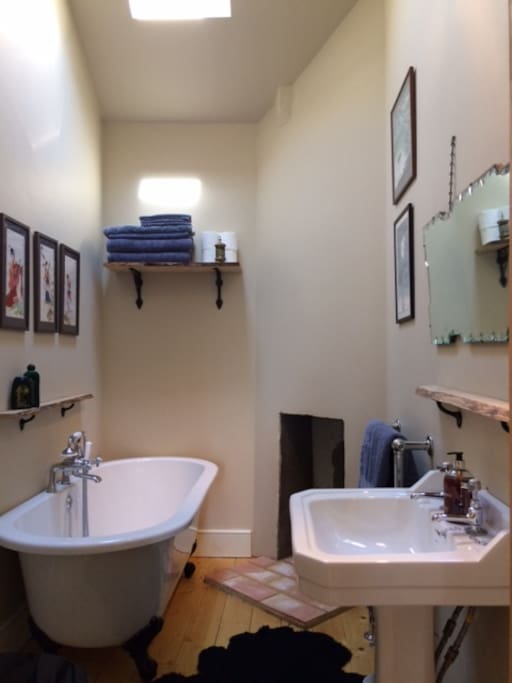 Newly fitted spacious bathroom and toilet with deep bath and sit in shower.