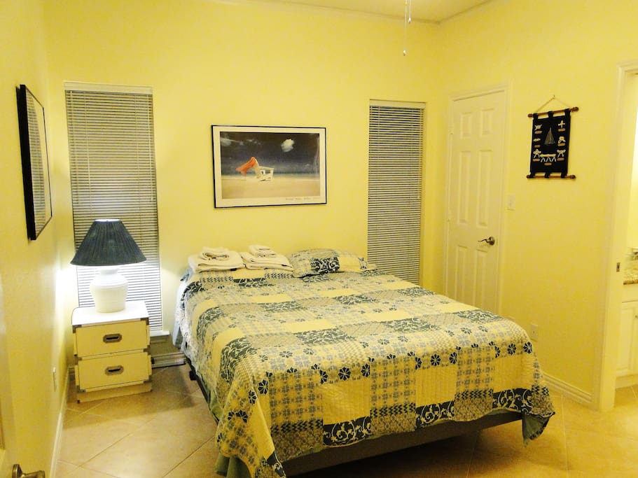 Queen bed room, bright and cheery, ample room to relax.