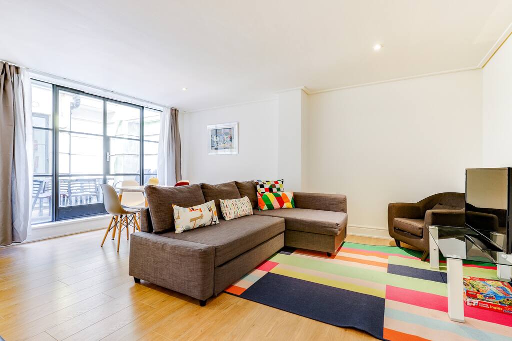The living room is full of natural light.