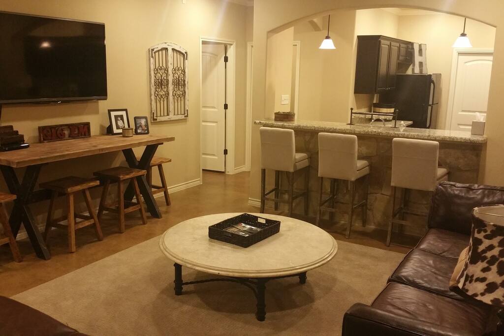 60 inch TV, seating for 10-12 in living room