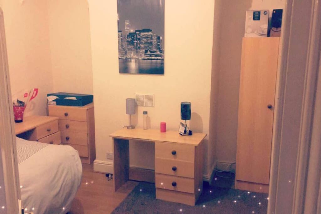 An amazing room with a lot of space and a comfortable double bed