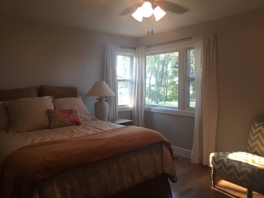 Spacious master bedroom on the main level with a sitting area.