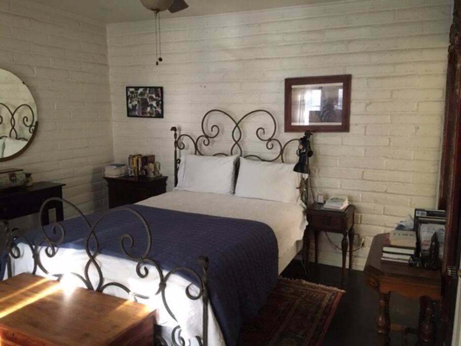 Queen sized bed. Attached private bathroom.