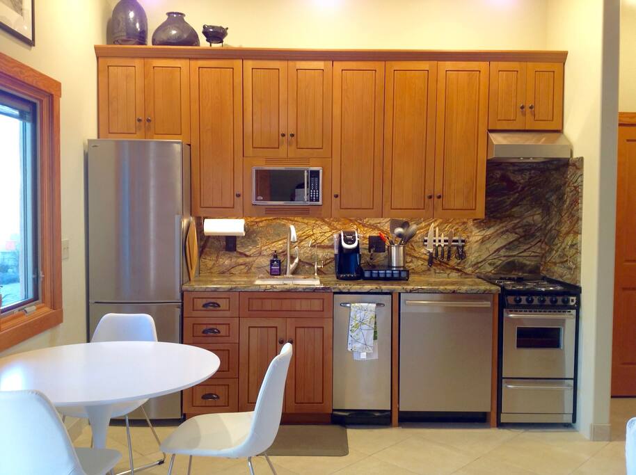 Fully stocked kitchen with small breakfast table or you can always eat on the patio and enjoy the birds, rabbits and sometimes if you get lucky our neighborhood owls.