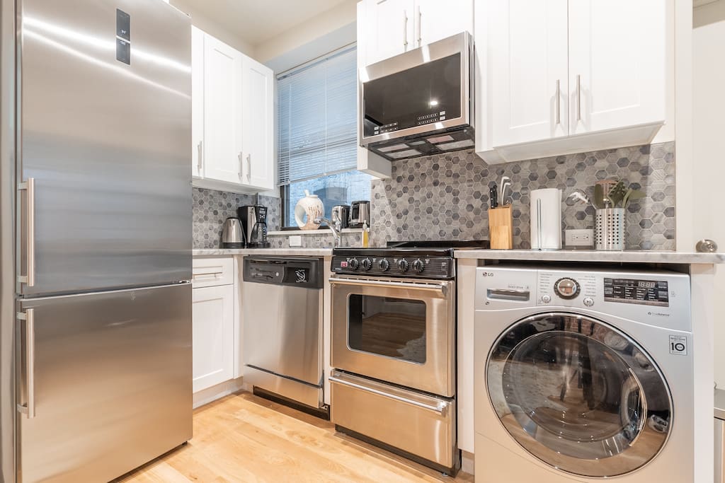 Recently renovated kitchen with brand new High-End Stainless Steel Appliances, Washing Machine, Stunning Mosaic backsplash. All amenities provided for cooking purposes