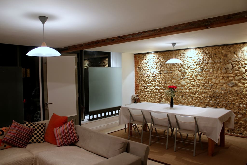 Dramatic exposed flint wall in the dining room