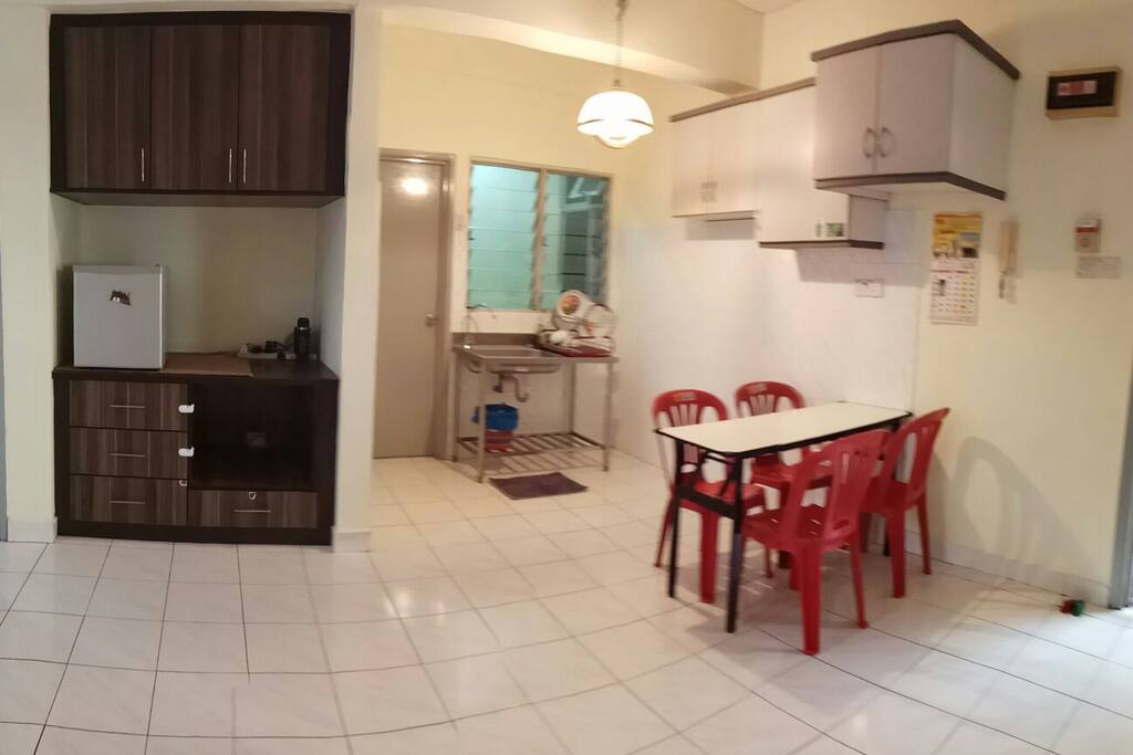 simple dining area with kitchenette,sink, mini fridge. however, no stove/ cooker is provided.