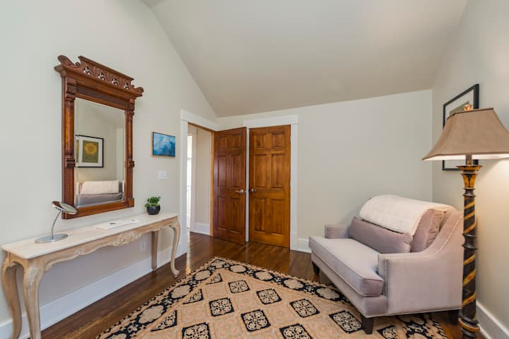A comfy chair in the master bedroom. . .