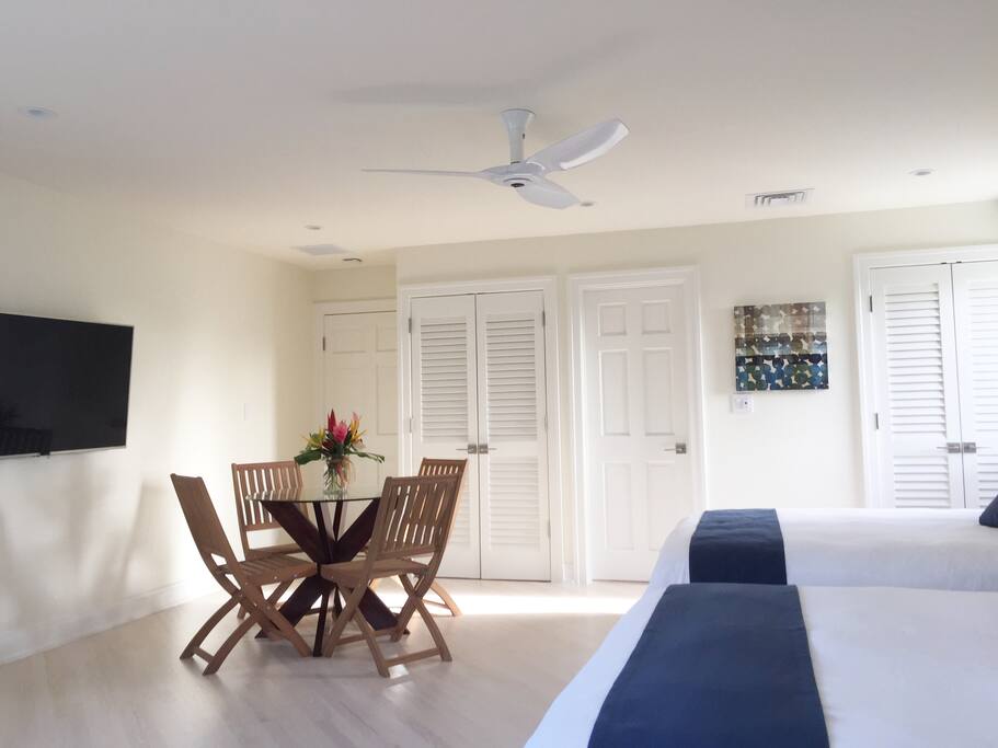 Flat screen 4K TV with Apple TV pulls out from wall to desired angle to view from sofa, dining area, or beds