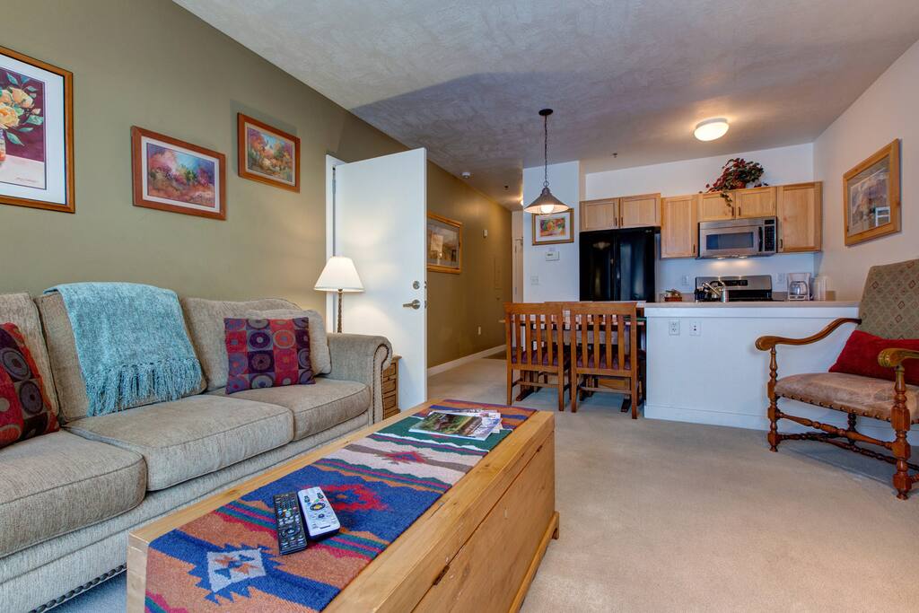 Main Living/Kitchen/Dining Area. Sleeper Sofa, Fully Equipped Kitchen, TV, Gas Fire Place and Balcony.