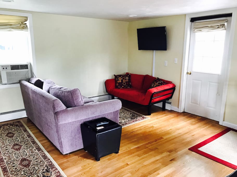 Couch opens to queen bed and futon is a single person futon. Apartment can sleep up to 7 people.