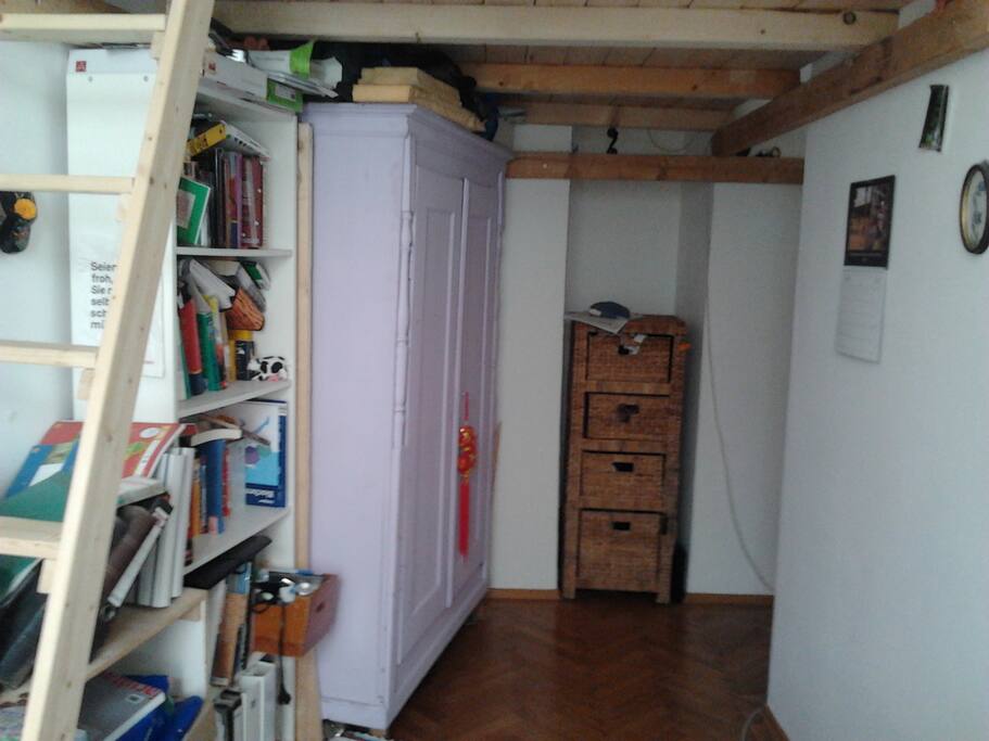 Part of room with stairs to loft bed