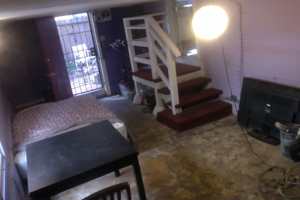 Stairs in basement lead to the kitchen.