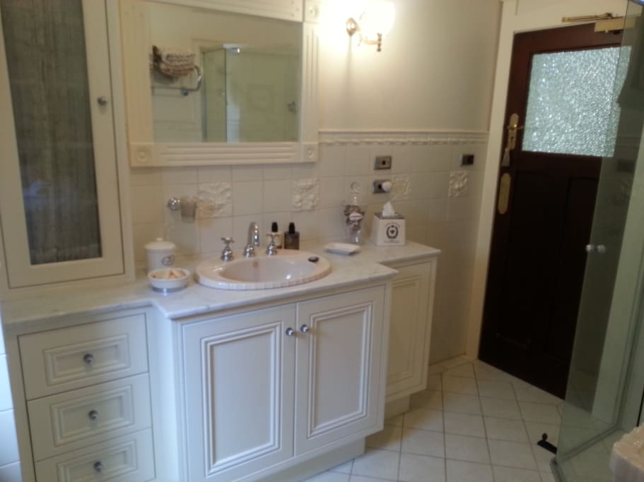 Marble top bathroom with shower