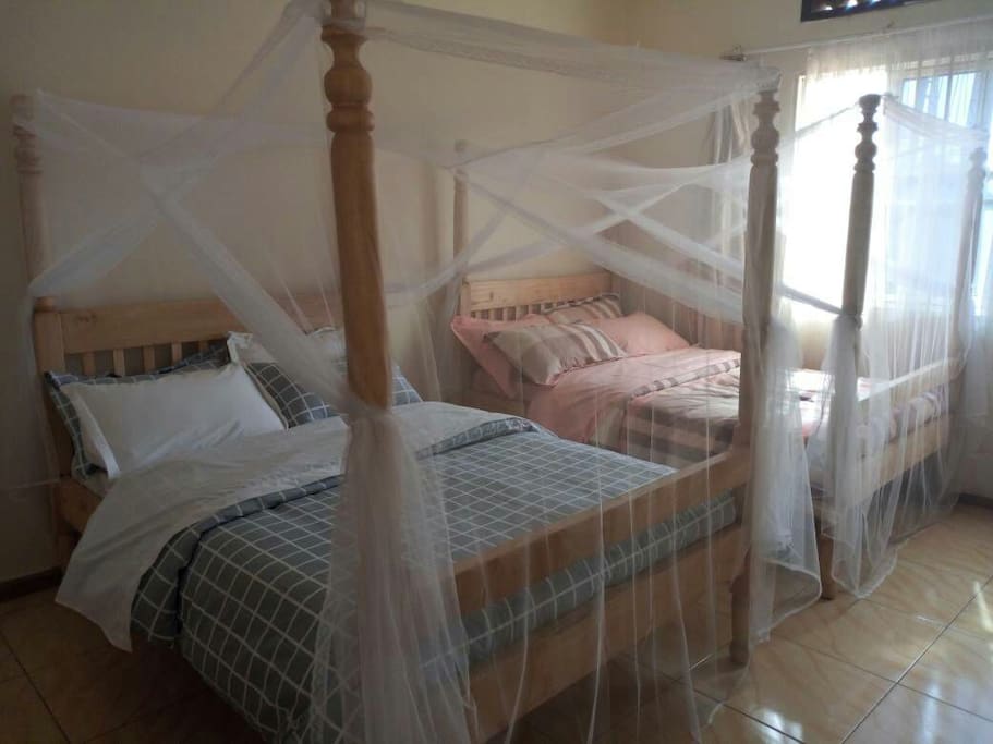 Both beds with Mosquito nets