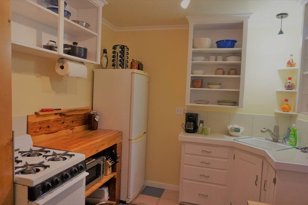 Kitchen with plates,cups,bowls and basic cooking implements