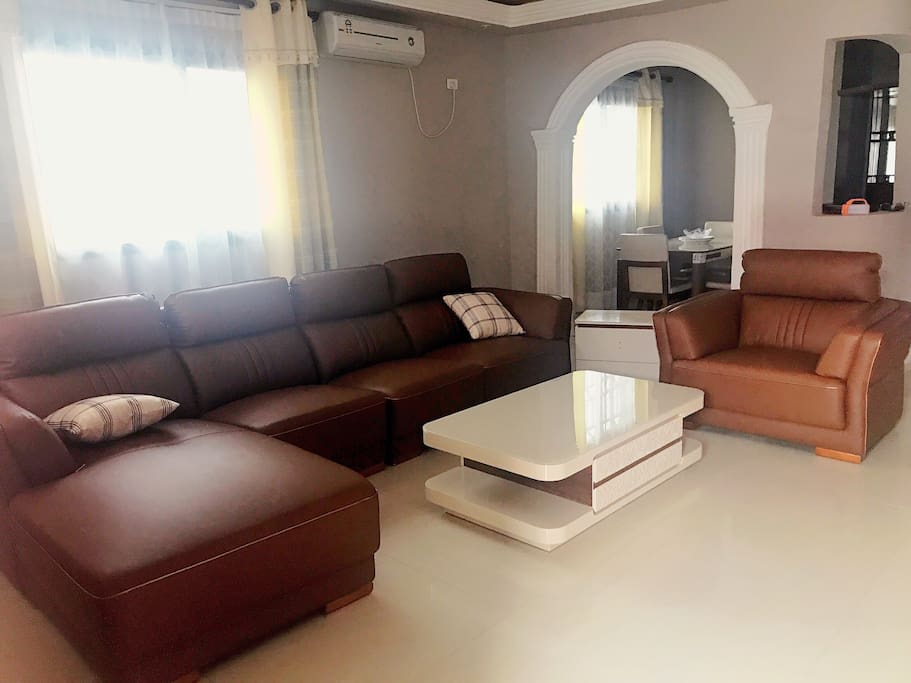 House no 1: Modern type lounge with comfortable leather couches and coffee table and side tables