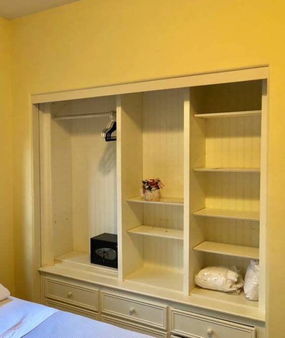 The other side of the room with built in dresser