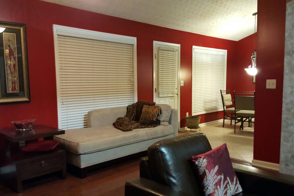 The sunroom sits off the kitchen with windows galore. On a sunny day, the sun seeps in and brings natural light into the home.