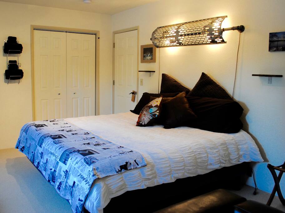Custom built headboard/wall light, constructed from a tractor exhaust heat shield