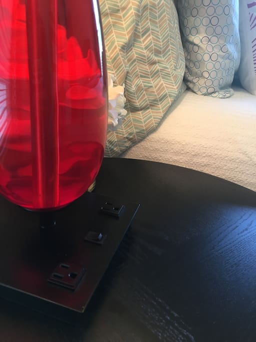Room has two night stands. Each lamp includes electrical outlets for your devices.