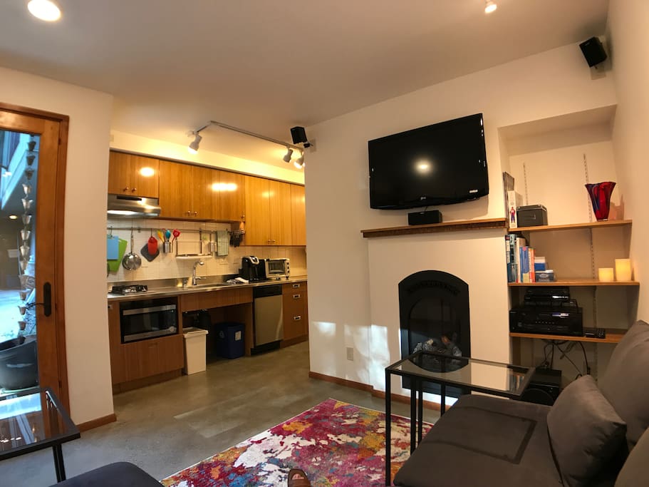View toward the kitchen with gas fireplace thermostatically controlled.