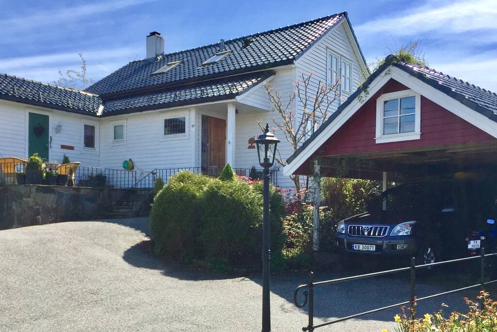 Front of the house with entrance and carport