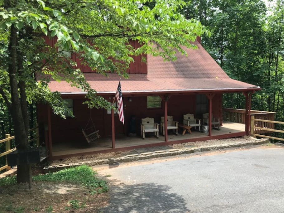 Level 1 step entry into into the cabin and relaxing rockers to enjoy the mountains