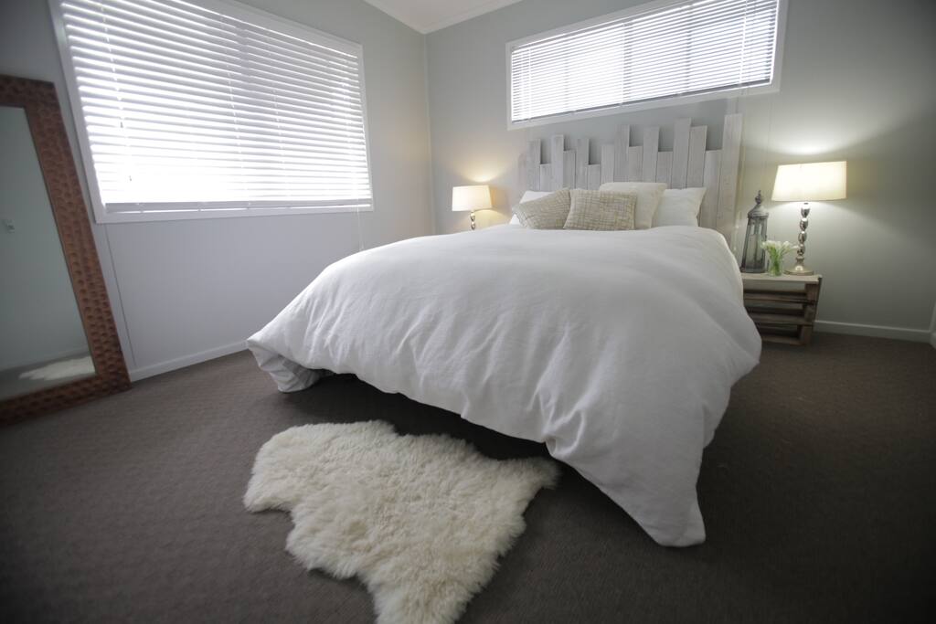 Spacious queen bedroom with air-conditioning
