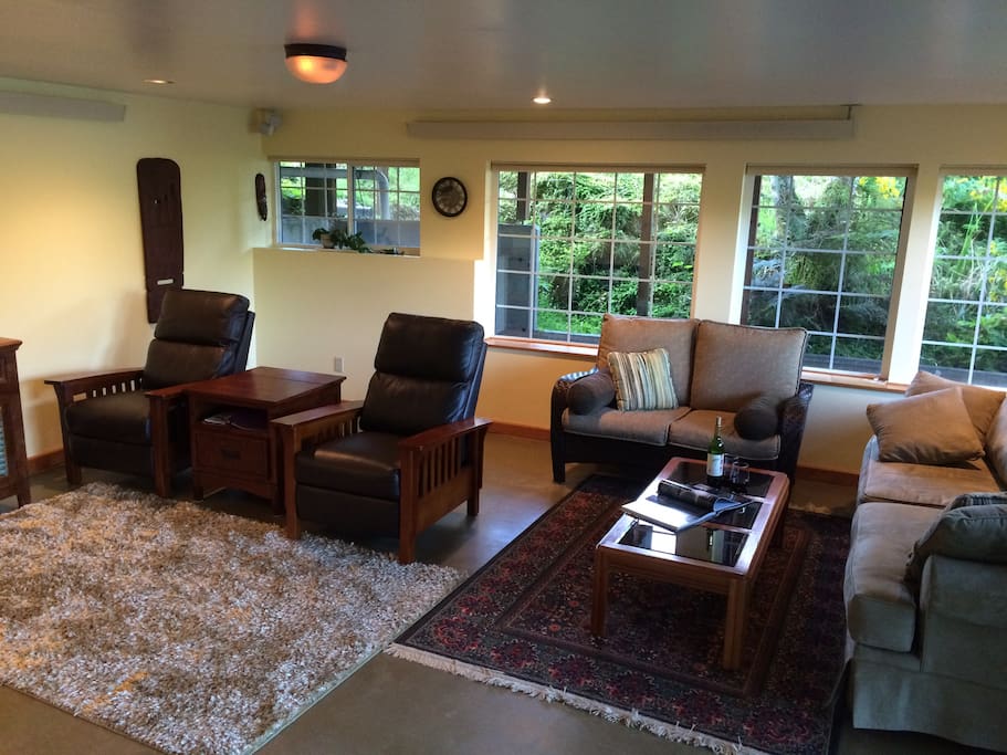 Great room with two recliners and sofa bed.