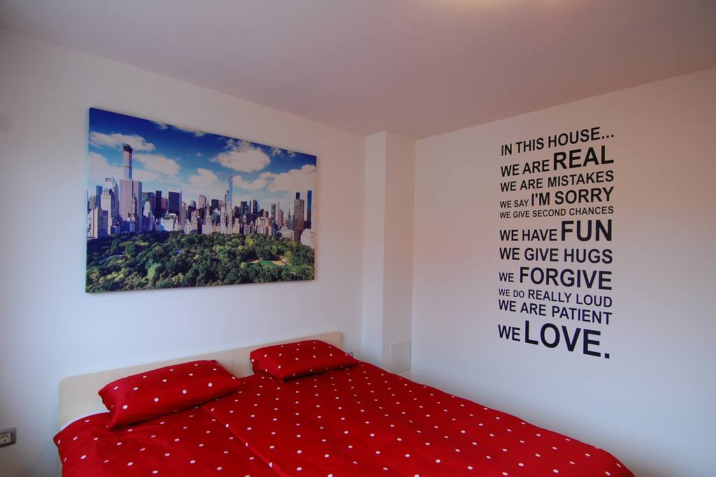 cosy bedroom with wardrobe and TV