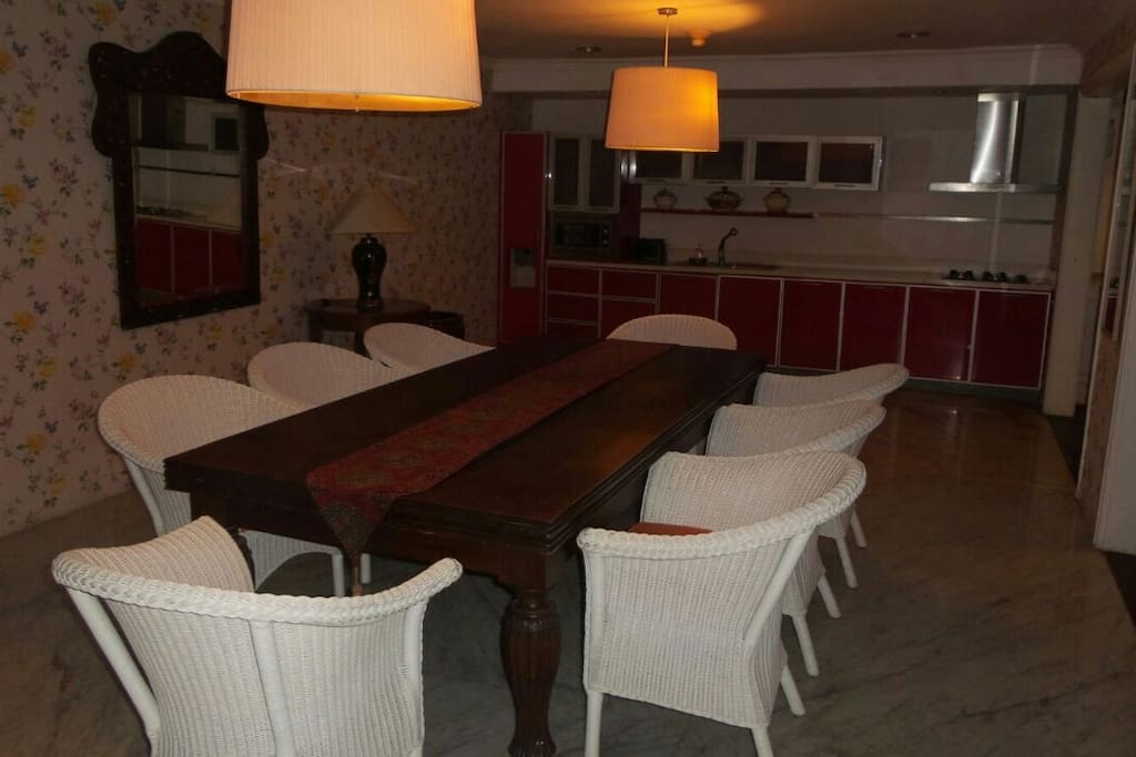 Dining room on the Main Floor seats up to eight guests with built in kitchenette for a chic yet functional dining experience. Equipped with Teka of Germany kitchen appliances and Royal Albert china.