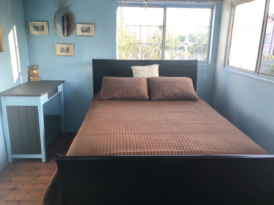 Small bedroom with a Queen size bed.