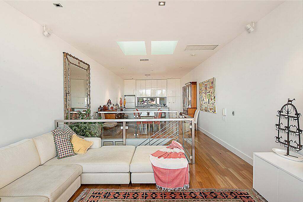 The lounge, dining, kitchen and balcony area offer a warm and friendly haven
