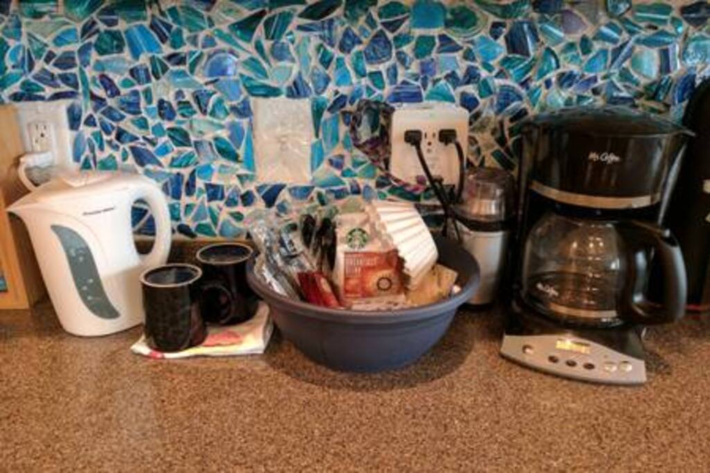 We have coffee, tea, and cocoa available at all times for guests. Travel mugs can be borrowed as well.