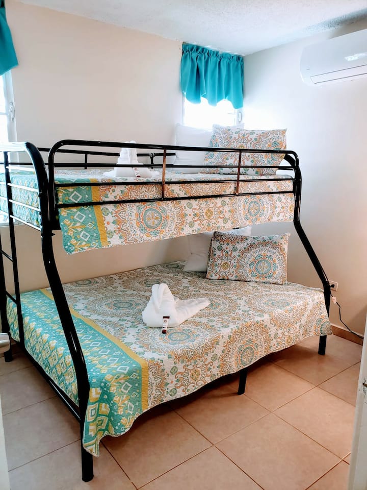 Twin bed on top and full bed on bottom.