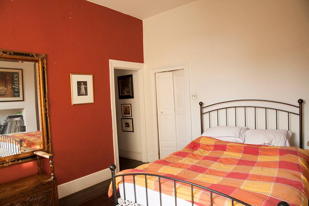 Double bedroom with dressing room off to the side.