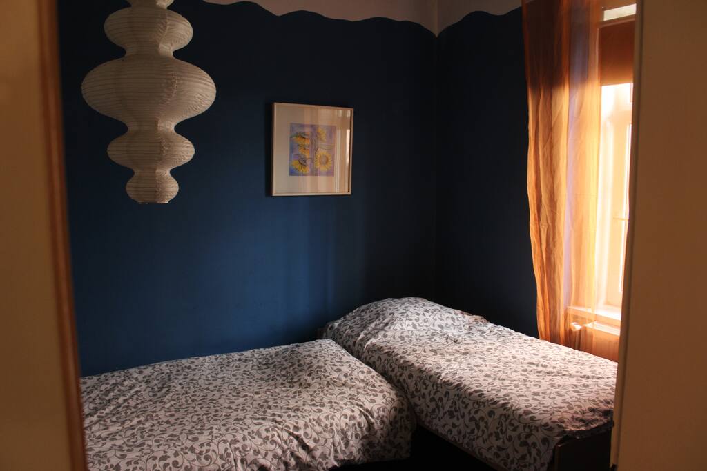 It contains 2 beds and has 2 entrances: one from the bathroom and one from the living room.