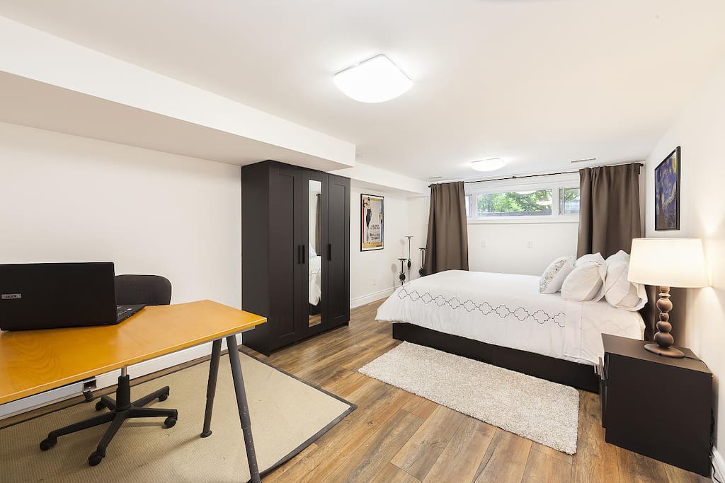 Very Spacious Romantic Serenity Room with personal computer table and workout area with weights and workout mat.