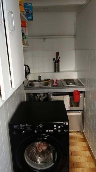 Fully furnished kitchen with stove, dishwasher, washing machine
